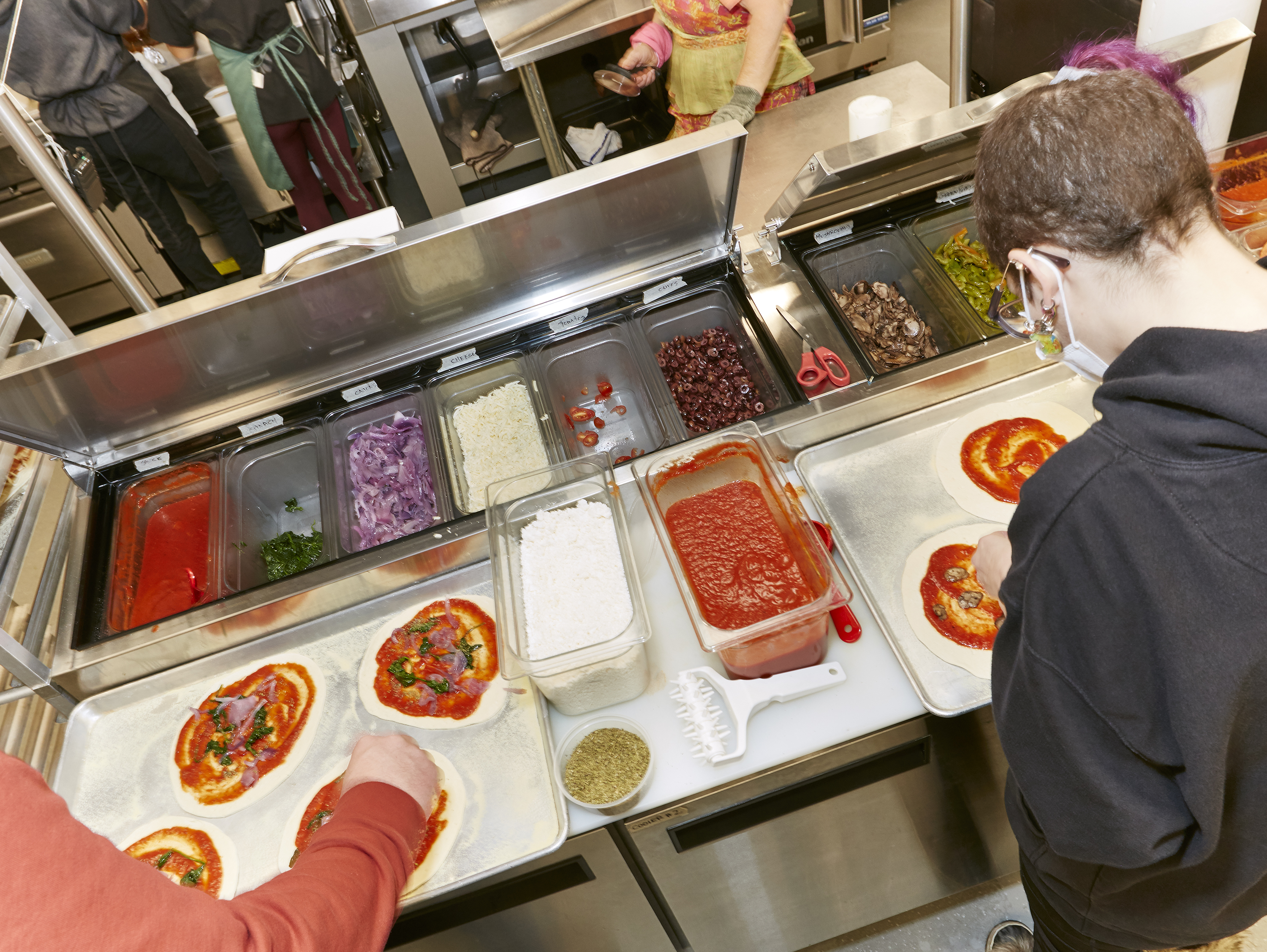 Making pizzas at Tiny Home Takeout