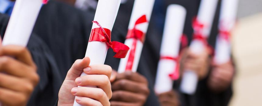 Image of students holding their merit certificate 